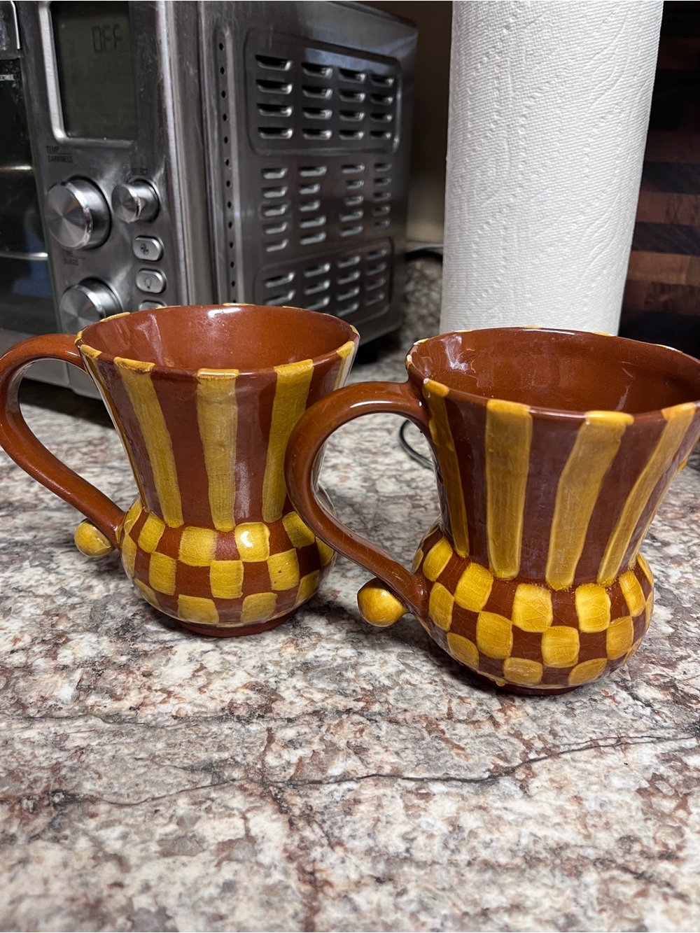 Two vintage MacKenzie-Childs Wittika Peanuts ceramic mugs